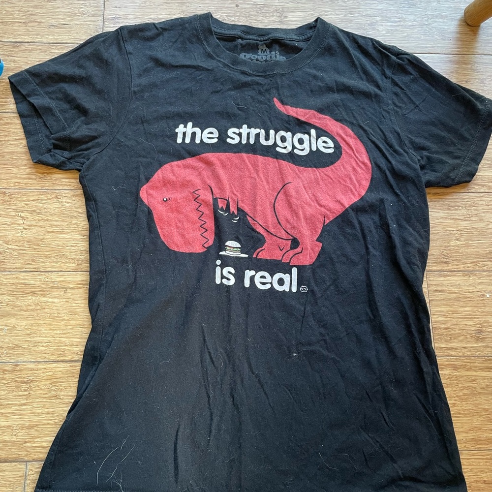 Black dinosaur t-shirt.